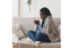 Black woman drinking tea immunity relaxation